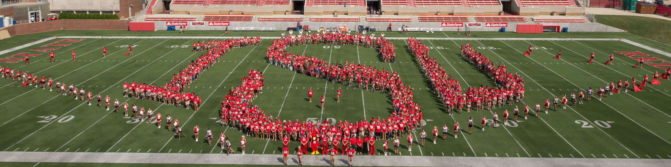 Students form 'ISU' on the field.