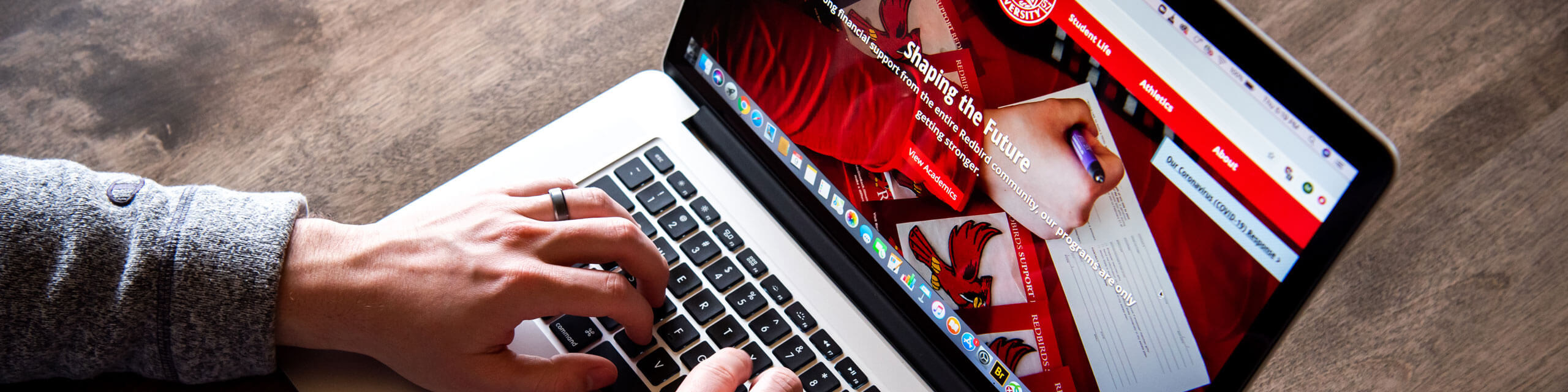 Person types on a laptop.